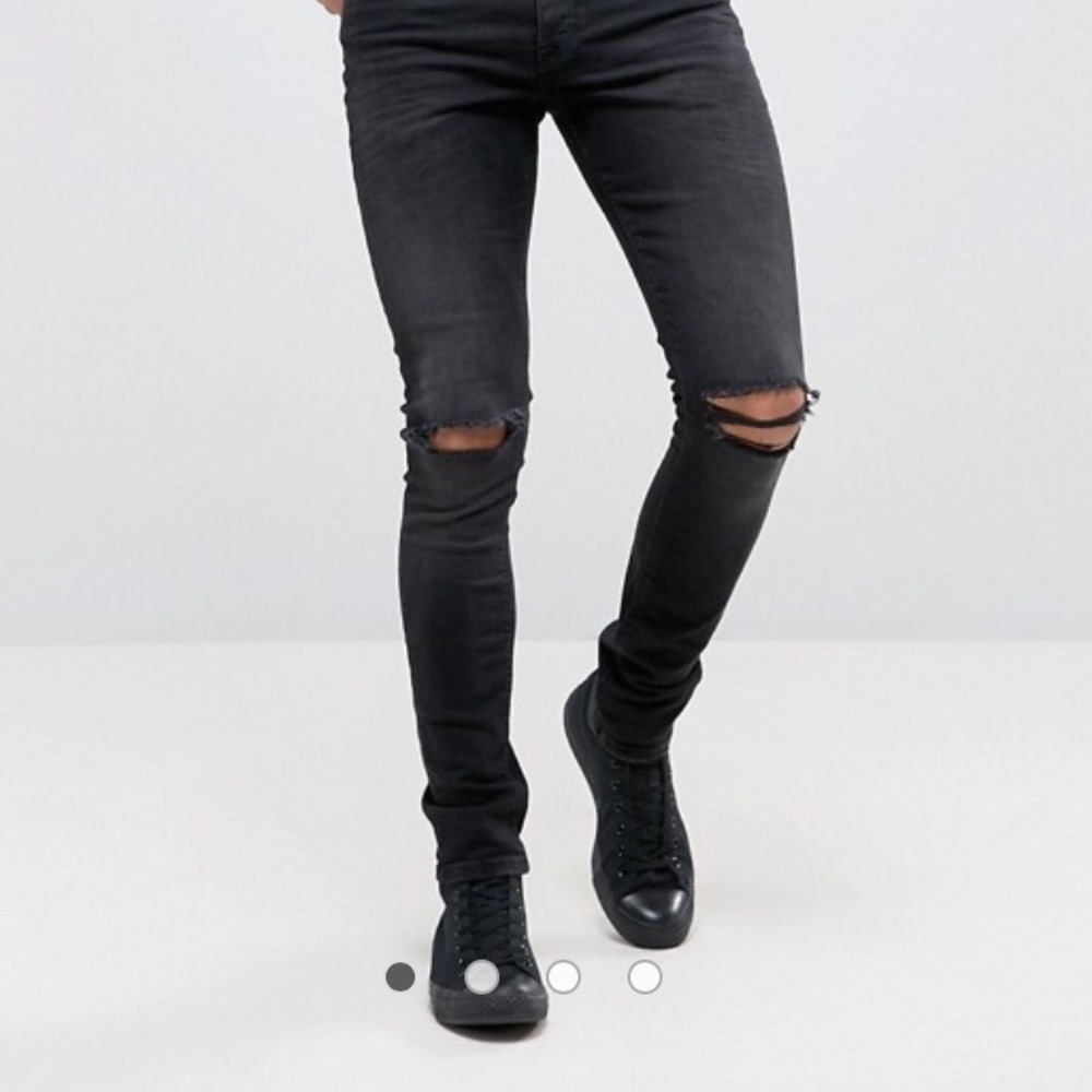 ASOS distresses super skinny jeans in washed black